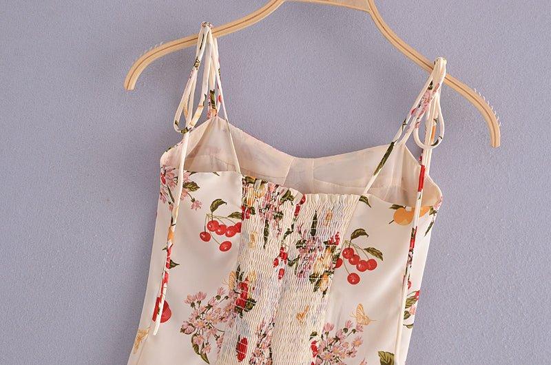 Elastic floral printed tube top with a sweetheart neckline and smocked detailing, made of polyester, boho vacation style.