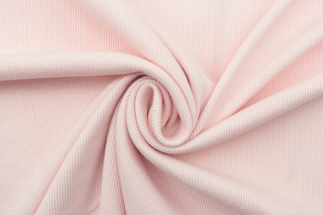pink textile in close up photography