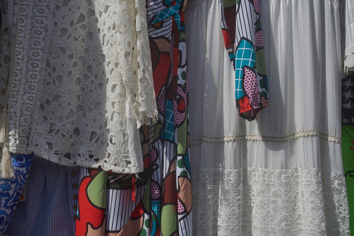 Colorful patterned and white lace clothing items