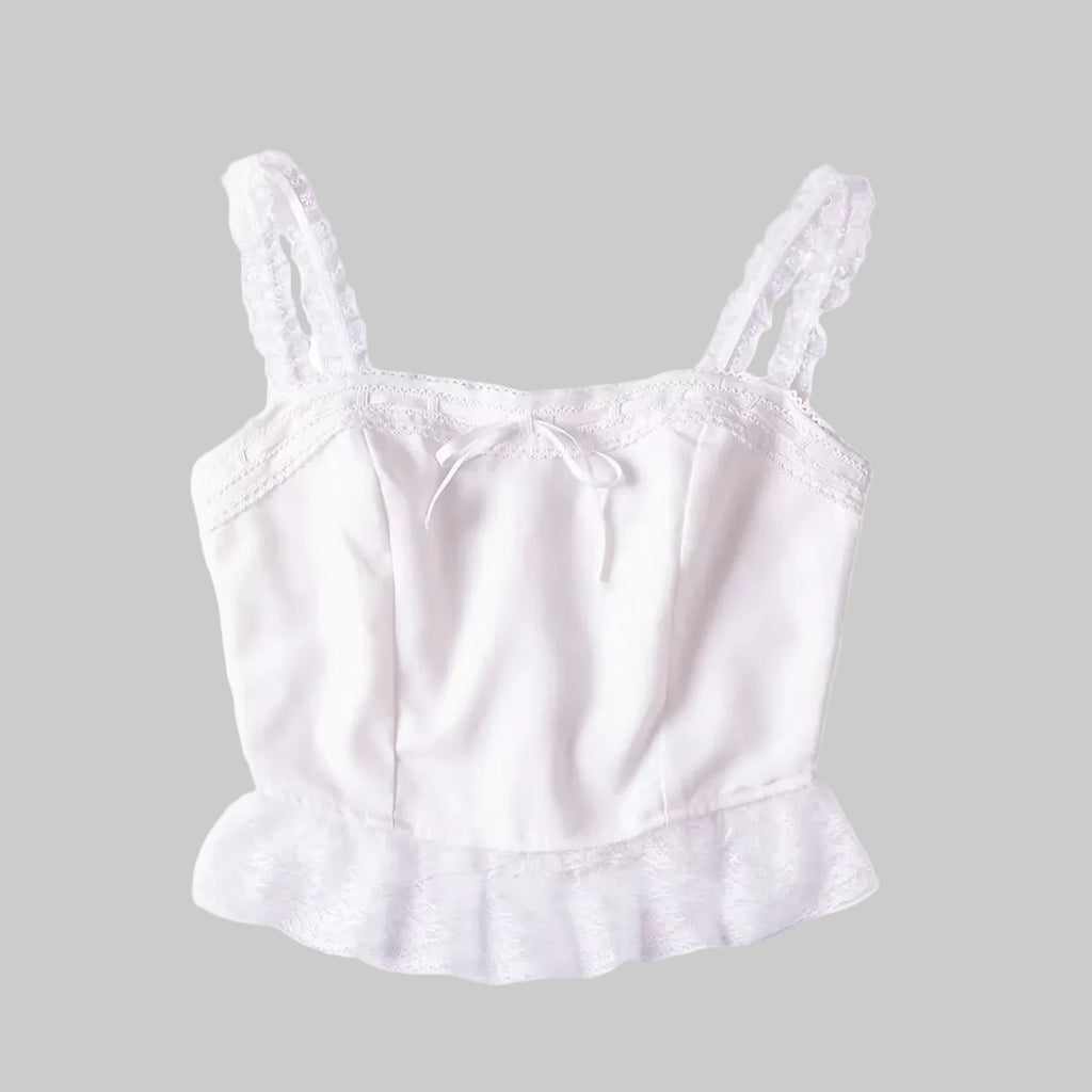 White satin camisole with lace trim on a white background