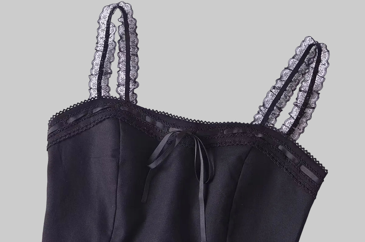 Black lace-trimmed camisole on a white background