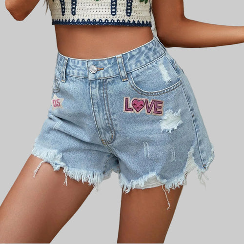Denim shorts with 'LOVE' embroidery on a neutral background