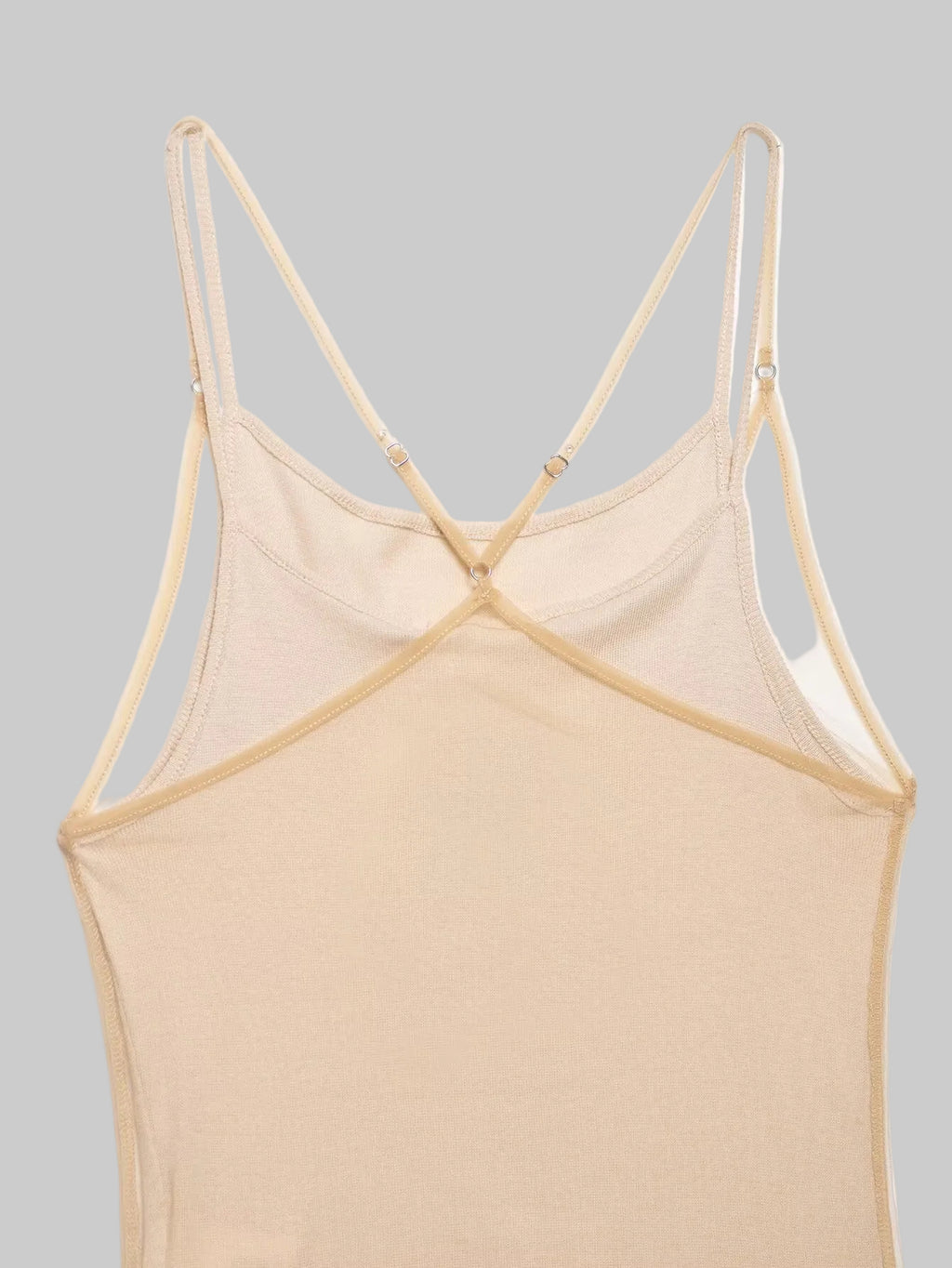 Beige strappy top on a light beige background