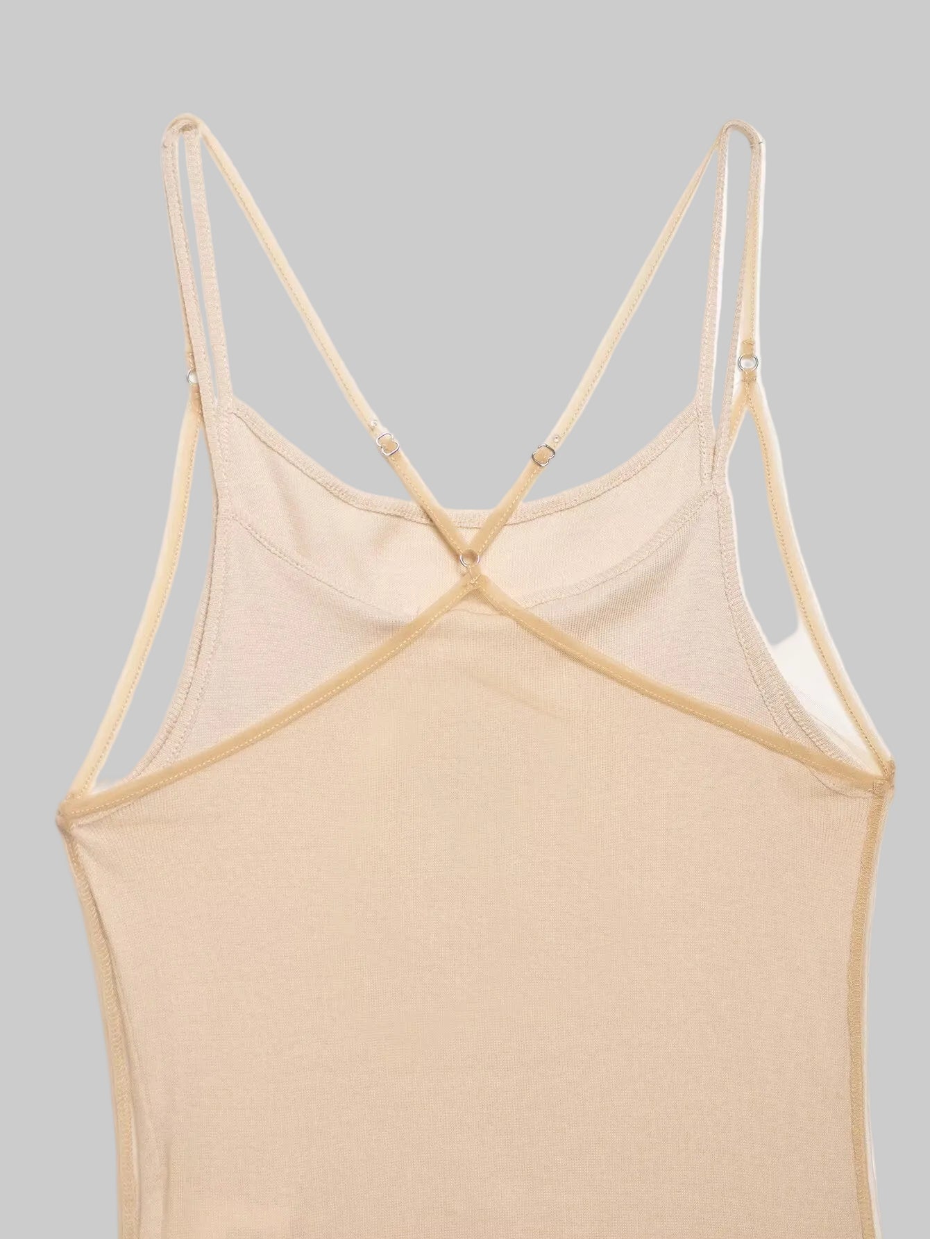 Beige strappy top on a light beige background