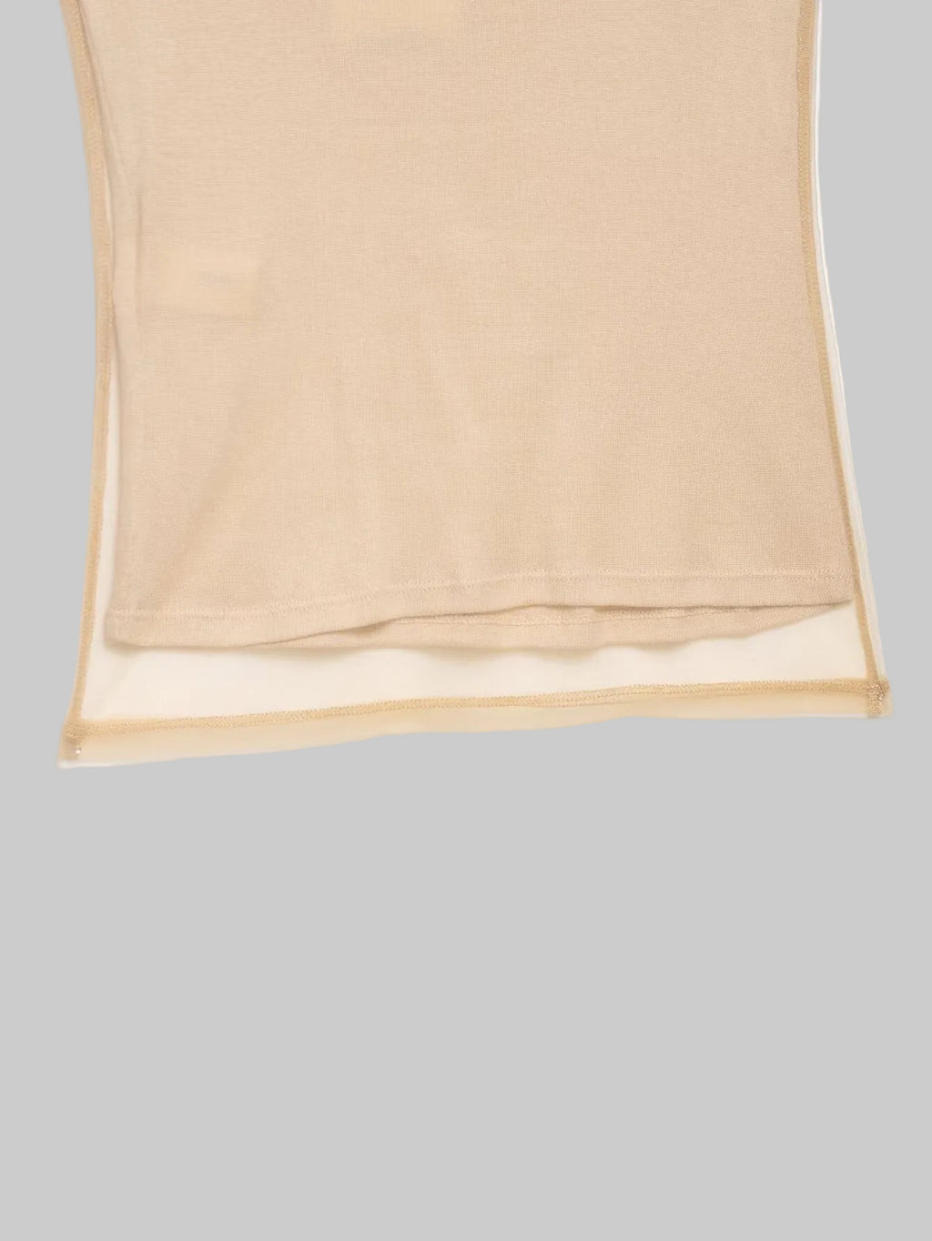 Beige sheer fabric on a white background