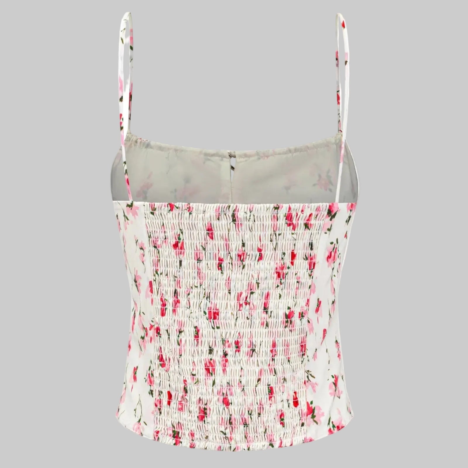 Floral patterned tank top with thin straps on a white background