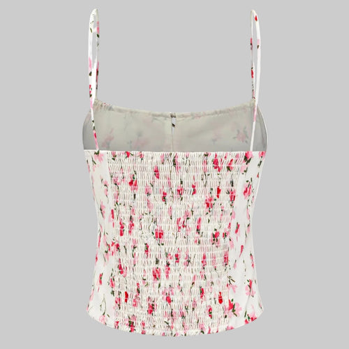 Floral patterned tank top with thin straps on a white background