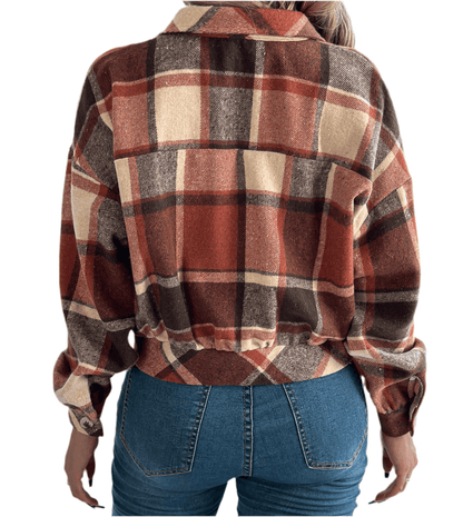 Back view of a plaid faux pocket long sleeve woolen shacket in autumn colors, styled with high-waisted jeans.