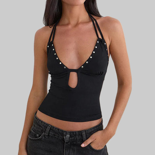 Black halter top with pearl embellishments on a plain background