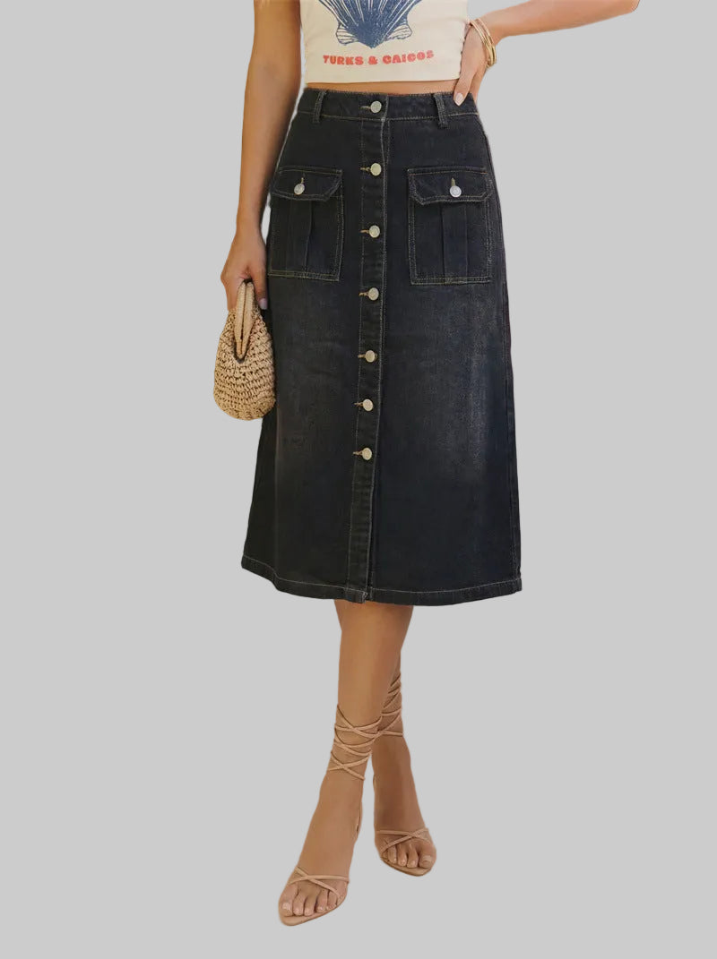 Person wearing a black button-up skirt with plants in the background