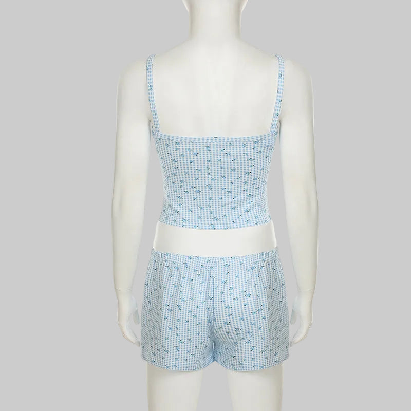 Mannequin wearing a blue and white checkered set on a white background