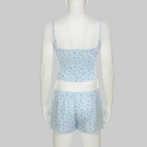 Mannequin wearing a blue and white checkered set on a white background