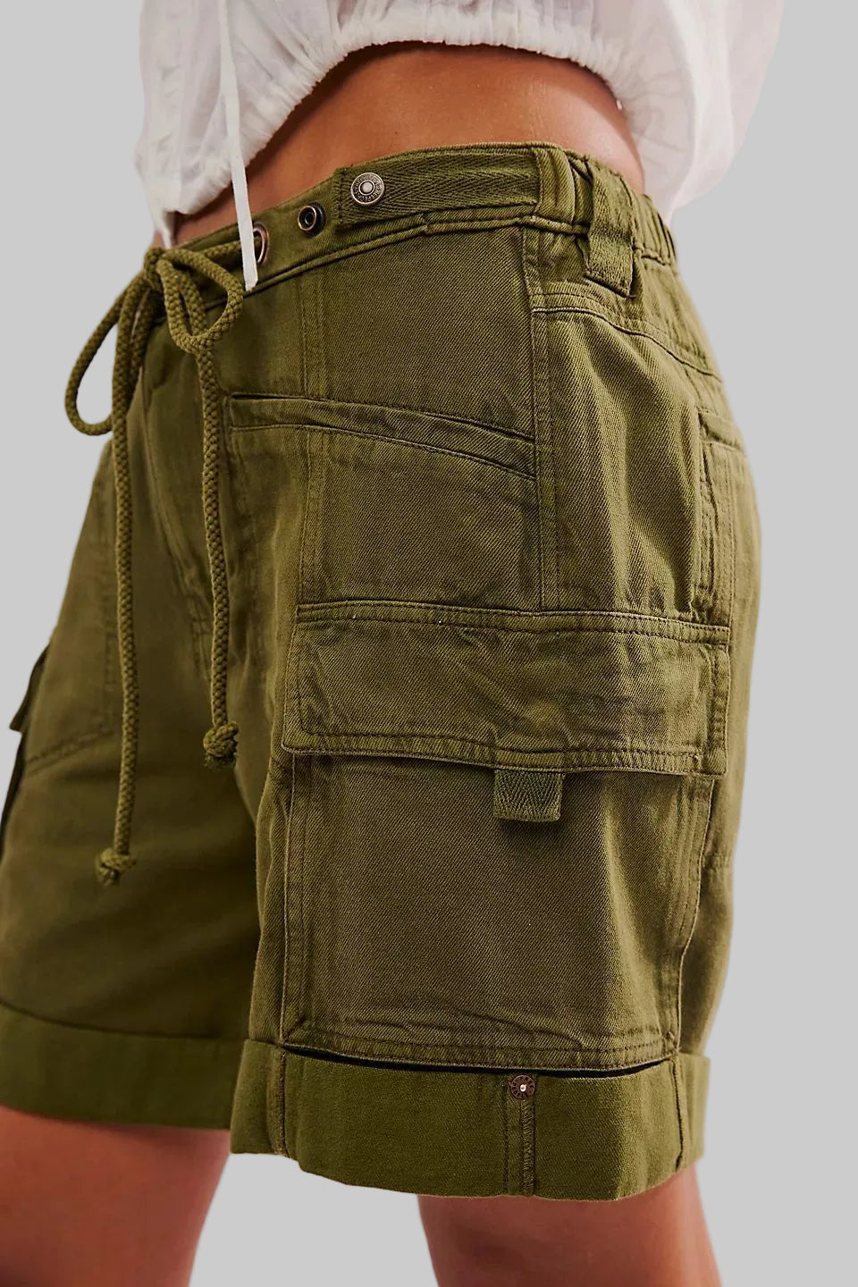 Green cargo shorts with a white background