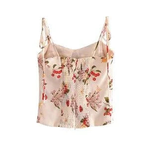 Floral printed elastic tube top with smocked design and sweetheart neckline.